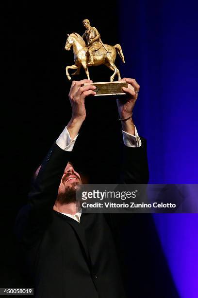 Director Alberto Fasulo accepts his award after winning the Golden MarcAurelio Award for Best Film for Tir at the Official Award Ceremony during the...
