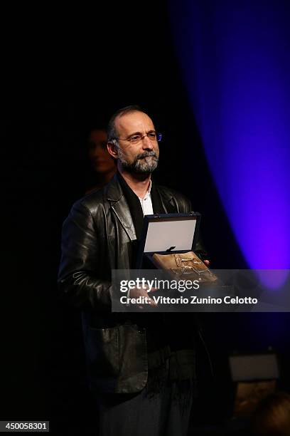 Tayfun Pirselimoglu poses with award for Best Screenplay for Ben o degilim at the Official Award Ceremony during the 8th Rome Film Festival at the...