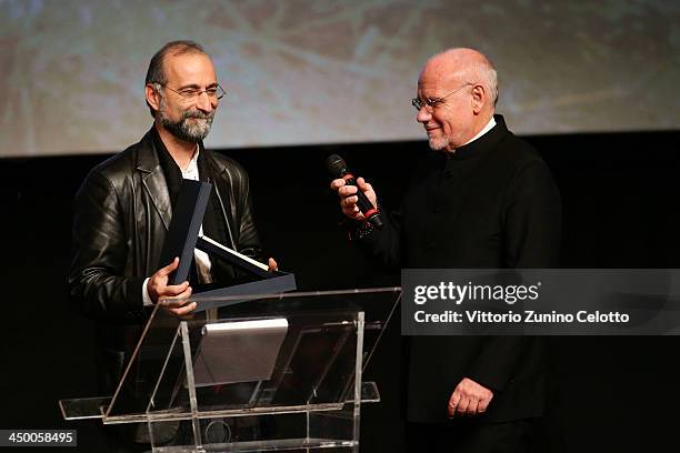 Tayfun Pirselimoglu with the award for Best Screenplay for Ben o Degilim with artistic diector of the festival Marco Muller at the Official Award...