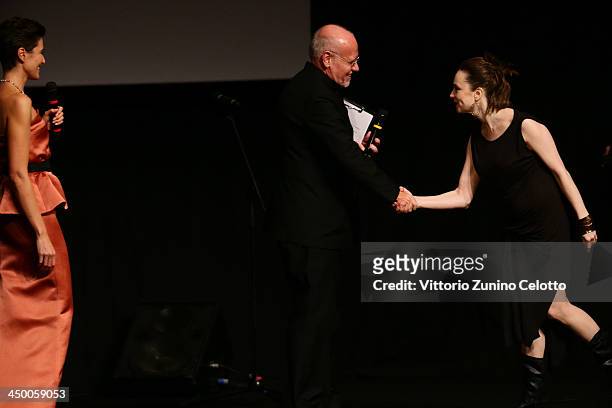 Director Aliona Polunina receives the CinemaXXI Award for Best Film for her movie 'Nepal Forever' from Rome Film Festival Marco Muller and hostess...