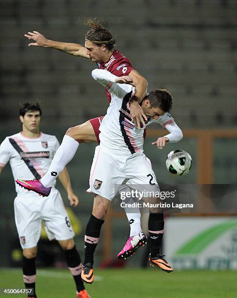 Federico Gerardi of Reggina competes for the ball in the air with Armin Bacinovic of Palermo during the Serie B match between Reggina Calcio and US...