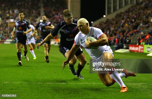 Ryan Hall of England slides over the line to score his second try during the Rugby League World Cup Quarter Final match between England and France at...