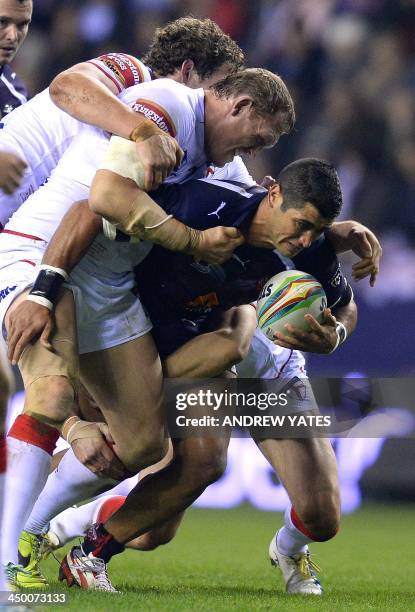 France's Younes Khattabi is tackled by England's Ben Westwood during the 2013 Rugby League World Cup quarter-final match between England and France...