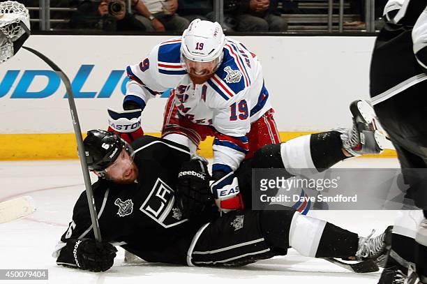 Brad Richards of the New York Rangers falls on top of Jake Muzzin of the Los Angeles Kings during the third period of Game One of the 2014 Stanley...