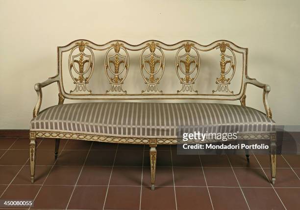 Settee , by tuscan manufactury, 18th Century, carved, gilded and painted wood.