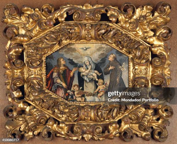 Wood frame with octagonal opening with festoons and phytomorphic decorations , by Piedmont manufacture, water gilding with red bole.