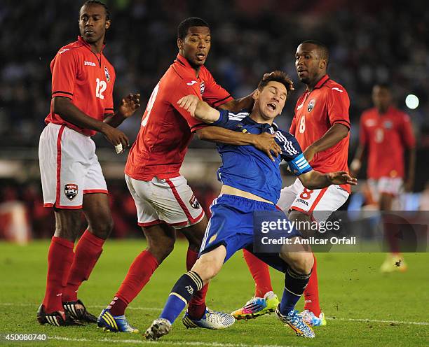Lionel Messi of Argentina receives a foul during a FIFA friendly match between Argentina and Trinidad & Tobago at Monumental Antonio Vespucio Liberti...