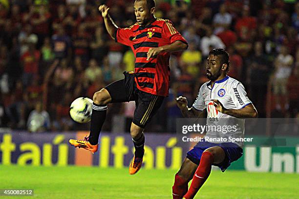 Ananias of Sport Recife battles for the ball with Lucas Fonseca of Bahia during the Brasileirao Series A 2014 match between Sport Recife and Bahia at...