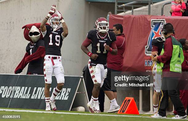Wide receiver Robby Anderson and quarterback P.J. Walker of the Temple University Owls react to a touchdown pass against the University of Central...