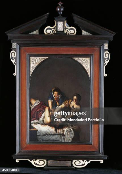 Judith Slaying Holofernes , by a copy from Artemisia Gentileschi, 1650 - 1650, 17th Century, oil on arched blackboard, 32 x 22 cm.