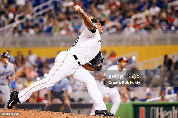 Carlos Marmol of the Miami Marlins delivers a pitch during the eighth inning of the game Los Angeles Dodgers at Marlins Park on May 02, 2014 in...
