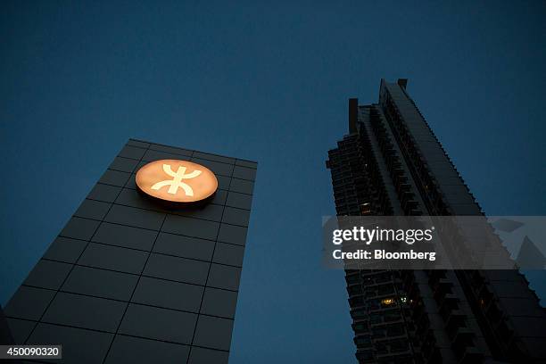 Corp. Signage is displayed in the Tung Chung district of Hong Kong, China, on Monday, May 26, 2014. Hong Kongs government forecasts a full-year...