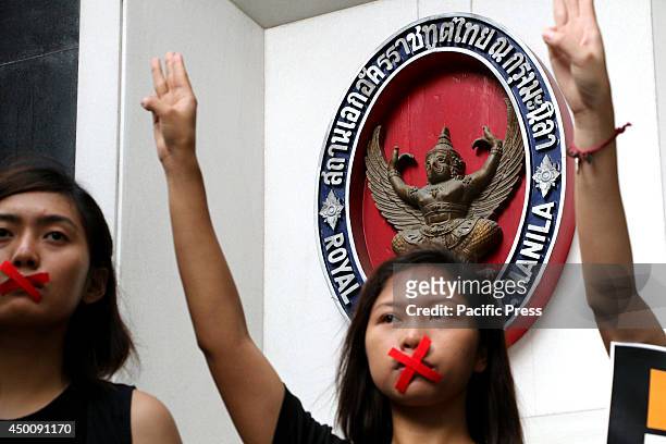 Members of Akbayan-Youth protest in front of the Royal Thai Embassy in Makati City to express their solidarity to the Thai people who are under...