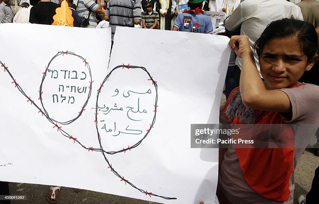 Palestinian children participate during a rally in Rafah in...