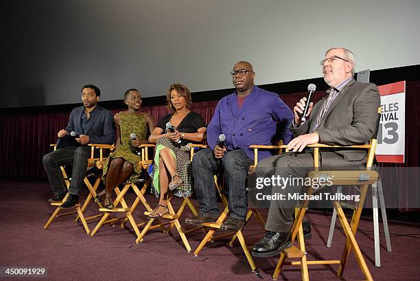Actors Chiwetel Ejiofor, Lupita Nyong'o and Alfre Woodard, director Steve McQueen and film critic Leonard Maltin attend a Q&A session at a screening...