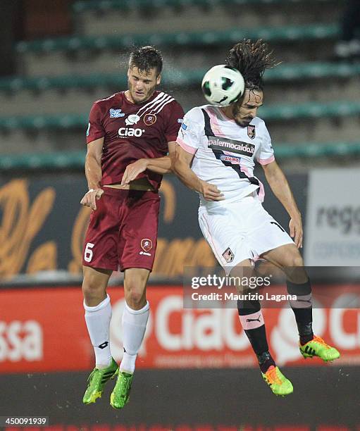 Kristian Ipsa of Reggina competes for the ball with Francesco Bolzoni of Palermo during the Serie B match between Reggina Calcio and US Citta di...