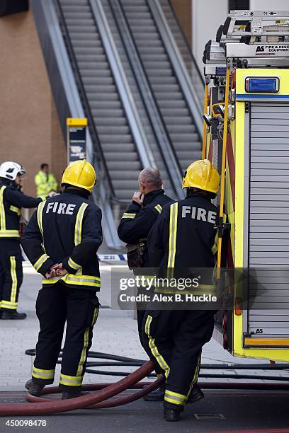 Firemen work in the area as people evacuate The Shard on June 5, 2014 in London, England. The Shard, London's tallest building standing at 310 meters...