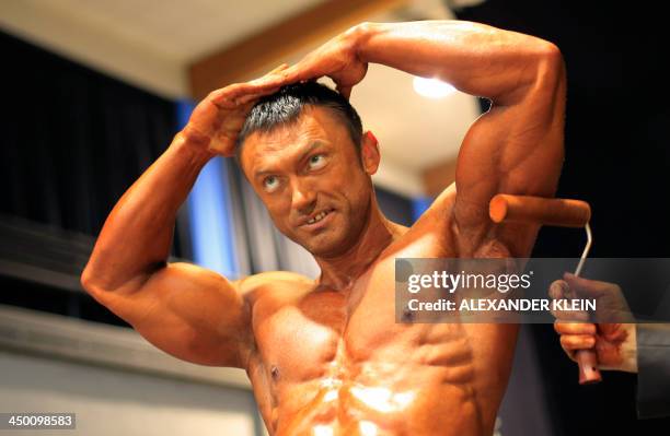 Ukraine's Andriy Kukharchuk prepares backstage in the "Men's Classic Bodybuilding over 180 cm" category during the World Classic Bodybuilding...