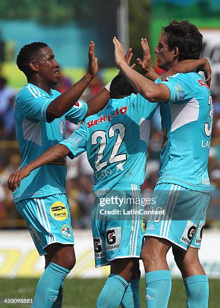 Jose Carlos Fernandez of Sporting Cristal celebrates with William Chiroque and Marcos Ortiz a scored goal against Union Comercio during a match...