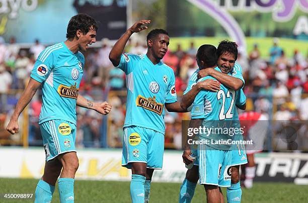 Jose Carlos Fernandez of Sporting Cristal celebrates with William Chiroque, Eduardo Uribe and Marcos Ortiz a scored goal against Union Comercio...