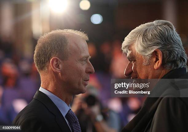 Thomas "Tom" Enders, chief executive officer of Airbus Group NV, left, speaks with Maurice Levy, chief executive officer of Publicis Groupe SA,...