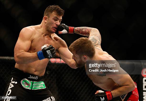 Cody Donovan punches Gian Villante in their light heavyweight bout during the UFC 167 event inside the MGM Grand Garden Arena on November 16, 2013 in...