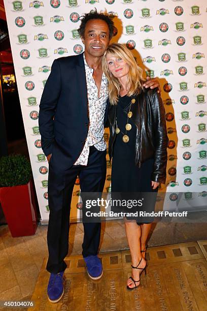 Former tennis player Yannick Noah and his wife producer Isabelle Camus attend the Legends of Tennis Dinner. Held at Restaurant Fouquet's whyle Roland...
