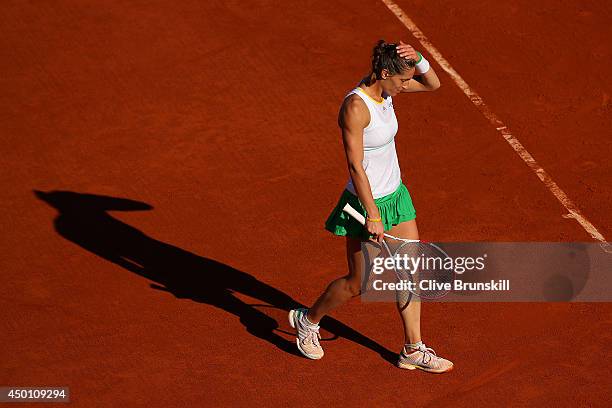 Andrea Petkovic of Germany reacts during her women's singles match against Simona Halep of Romania on day twelve of the French Open at Roland Garros...