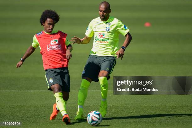 William and Maicon take part in a training session of the Brazilian national football team at the squad's Granja Comary training complex, in...