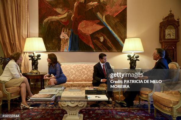 Portugal's President Anibal Cavaco Silva and his wife Maria Cavaco Silva speak with Mexico's President Enrique Pena Nieto and his wife Angelica...