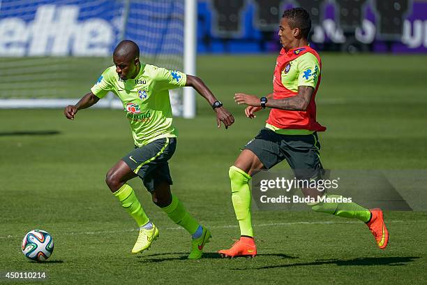 Ramires and Luis Gustavo take part in a training session of the Brazilian national football team at the squad's Granja Comary training complex, in...