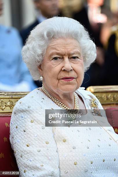 Queen Elizabeth II attends a reception at the British Embassy during an Official visit in Paris ahead of the 70th Anniversary Of The D-Day on June 5,...