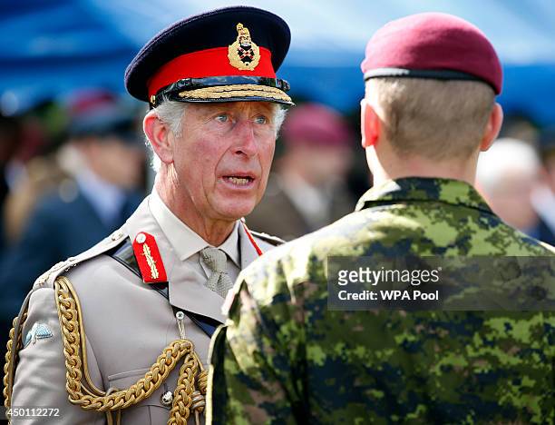 Prince Charles, Prince of Wales, Colonel-in-Chief, Army Air Corps, greets current members of the Canadian Parachute Corps after a service of...