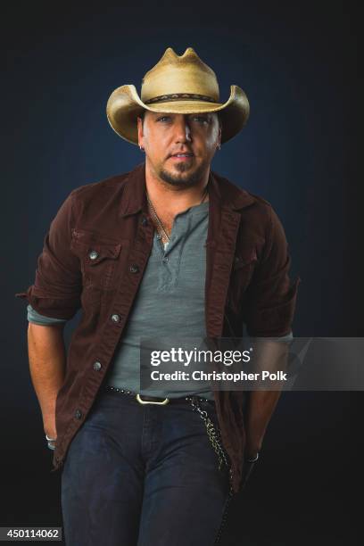 Jason Aldean poses at the 2014 CMT Music Awards - Wonderwall Portrait Studio at Bridgestone Arena on June 4, 2014 in Nashville, Tennessee.