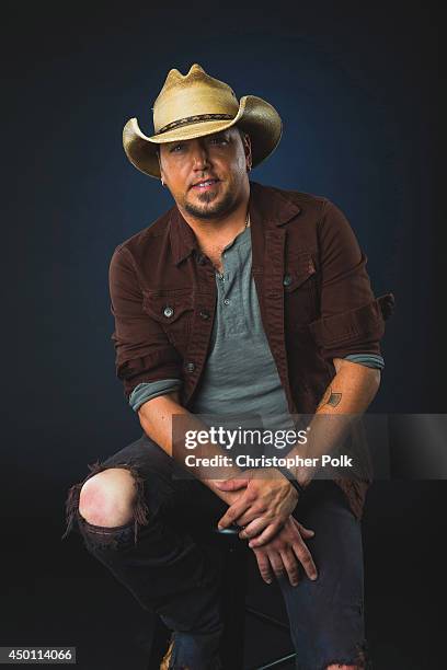 Jason Aldean poses at the 2014 CMT Music Awards - Wonderwall Portrait Studio at Bridgestone Arena on June 4, 2014 in Nashville, Tennessee.