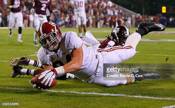 Brian Vogler of the Alabama Crimson Tide dives for a touchdown against Jamerson Love of the Mississippi State Bulldogs at Davis Wade Stadium on...
