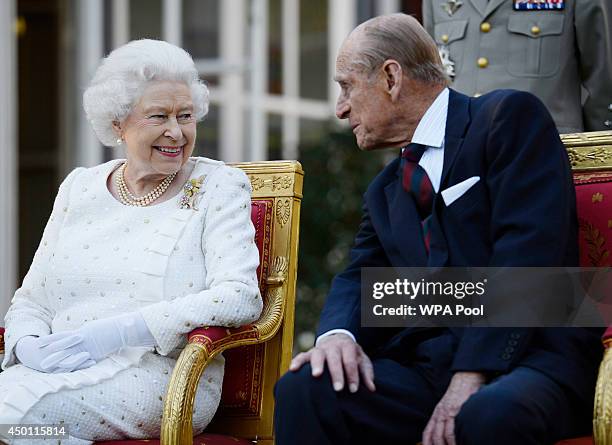 Queen Elizabeth II and Prince Philip, Duke of Edinburgh attend a garden party in Paris, hosted by Sir Peter Ricketts, Britain's Ambassador to France...