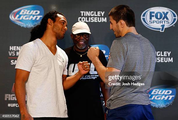 Opponents Benson Henderson and Rustam Khabilov face off during the UFC Ultimate Media day at EXPO New Mexico on June 5, 2014 in Albuquerque, New...