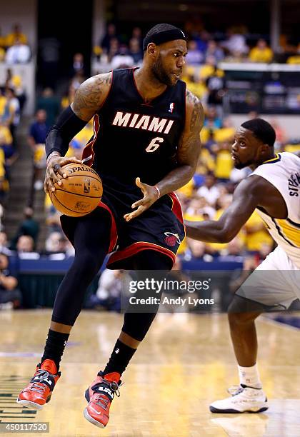 LeBron James of the Miami Heat drives to the basket against Lance Stephenson of the Indiana Pacers during Game Five of the Eastern Conference Finals...