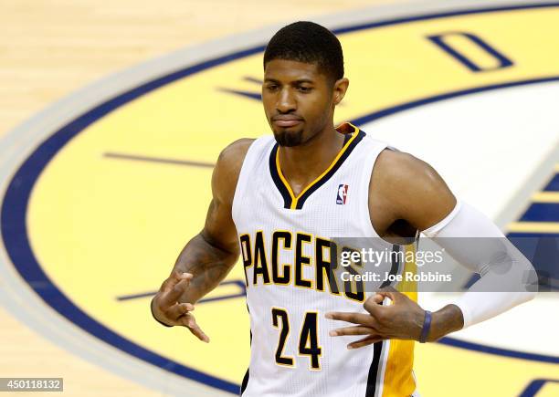Paul George of the Indiana Pacers celebrates after hitting a shot against the Miami Heat during Game Five of the Eastern Conference Finals of the...