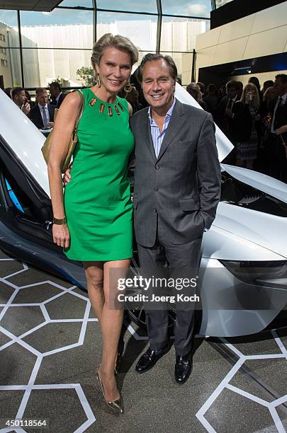 Countess Stephanie von Pfuel and her boyfriend publisher Hendrik teNeues attend the launch of the BMW i8 plug-in hybrid sports car at BMW World on...