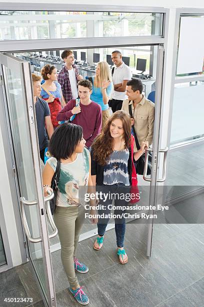 college students leaving classroom - left eye stock pictures, royalty-free photos & images