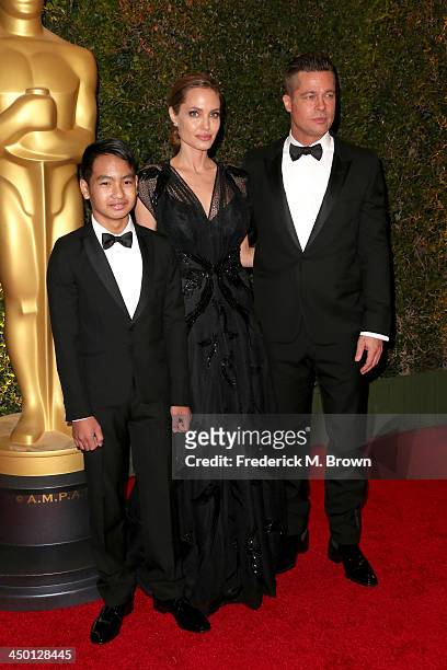 Maddox Jolie-Pitt, actress Angelina Jolie and actor Brad Pitt arrive at the Academy of Motion Picture Arts and Sciences' Governors Awards at The Ray...
