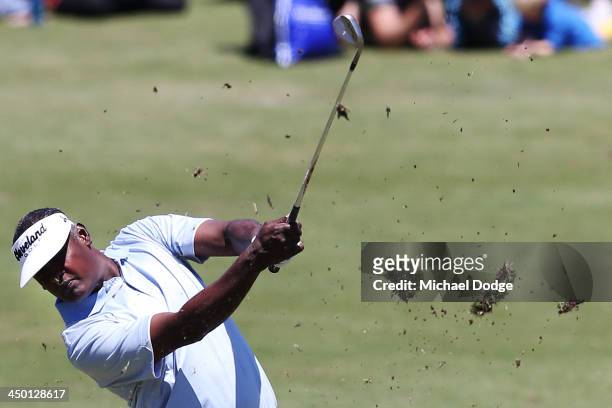 Vijay Singh of Fiji hits an approach shot off the first tee during round four of the 2013 Australian Masters at Royal Melbourne Golf Course on...