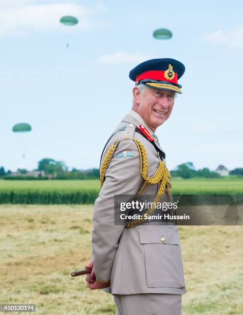 Prince Charles, Prince of Wales watches a parachute jump just outside Rainville during D-Day 70 Commemorations on June 5, 2014 in Ranville, France.