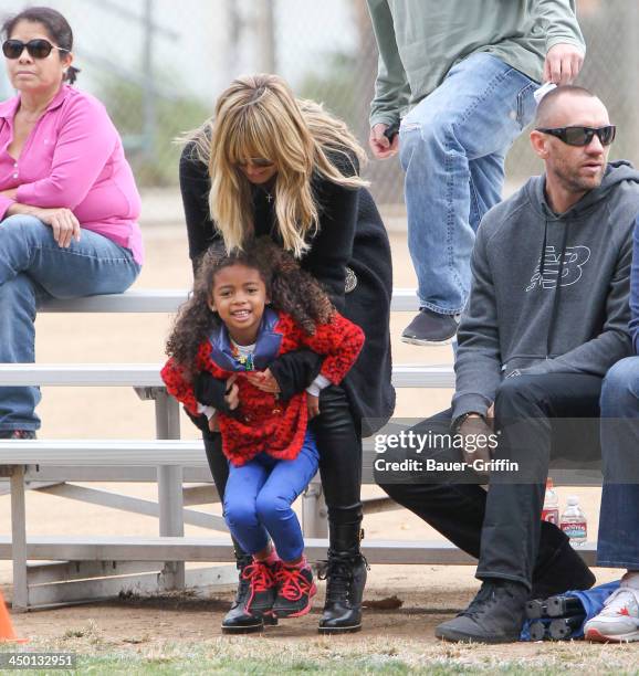 November 16: Heidi Klum and Martin Kristen with Lou Samuel are seen on November 16, 2013 in Los Angeles, California.