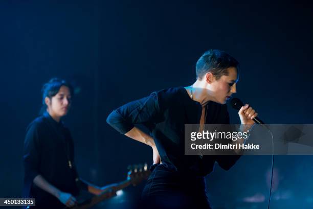 Ayse Hassan and Jehnny Beth of Savages perform on stage at Crossing Border Festival on November 16, 2013 in The Hague, Netherlands.