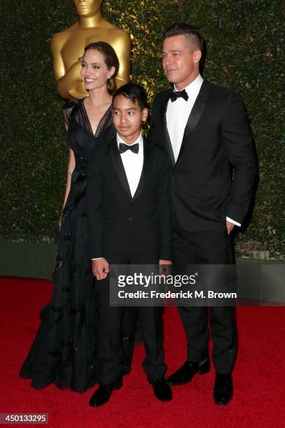 Actress Angelina Jolie, Maddox Jolie-Pitt and actor Brad Pitt arrive at the Academy of Motion Picture Arts and Sciences' Governors Awards at The Ray...
