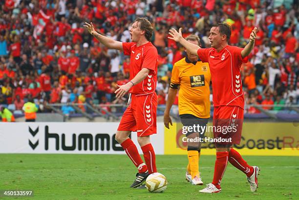 Steve McManaman and Vladimir Smicer appeal to the touch judges during the Legends match between Liverpool FC Legends and Kaizer Chiefs Legends at...