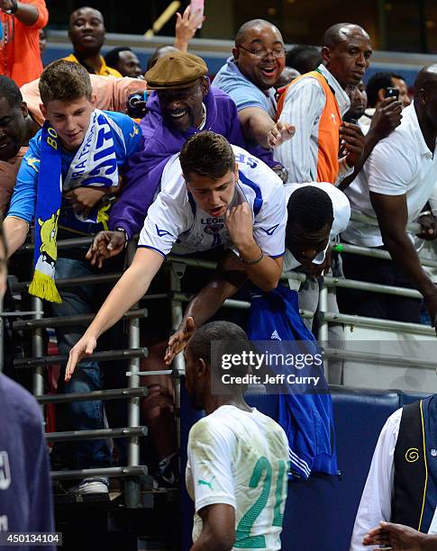 Fans greet Jean-Daniel Akpa Akpro of the Ivory Coast as he walks off the field after a friendly match against Bosnia-Herzegovina at Edward Jones Dome...